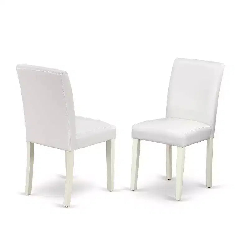 Tavolo da pranzo 5 pezzi con piano in legno massello finitura lino bianco e 4 sedie Parson rivestite in similpelle bianca